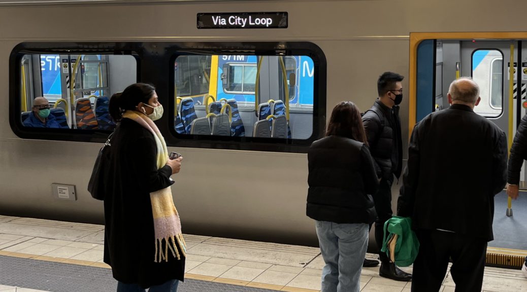 Passengers boarding a train at Flinders Street station
