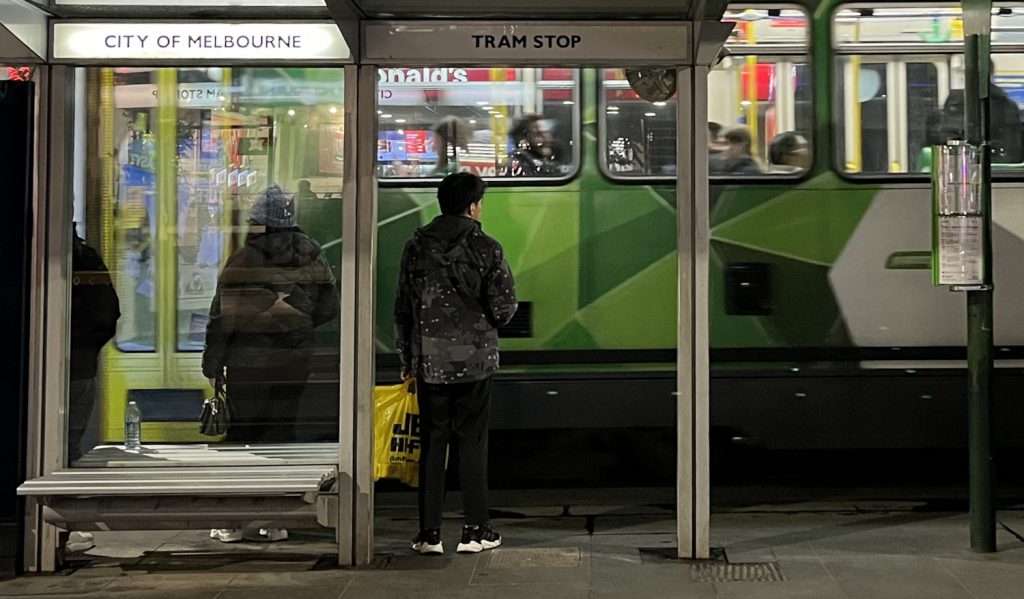 Passengers at a tram stop