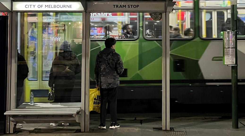 Passengers at a tram stop