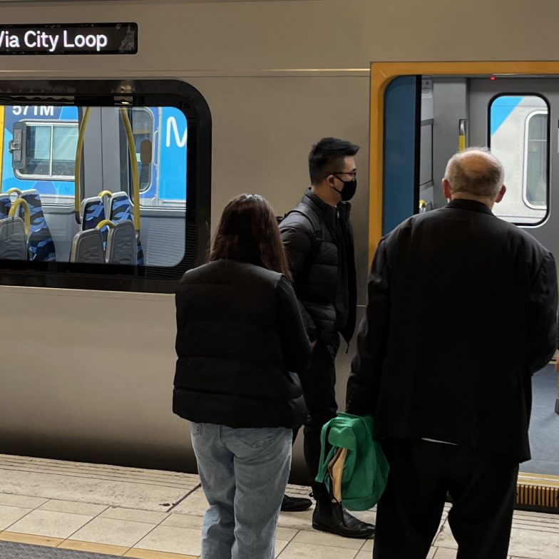 Passengers boarding a train at Flinders Street station