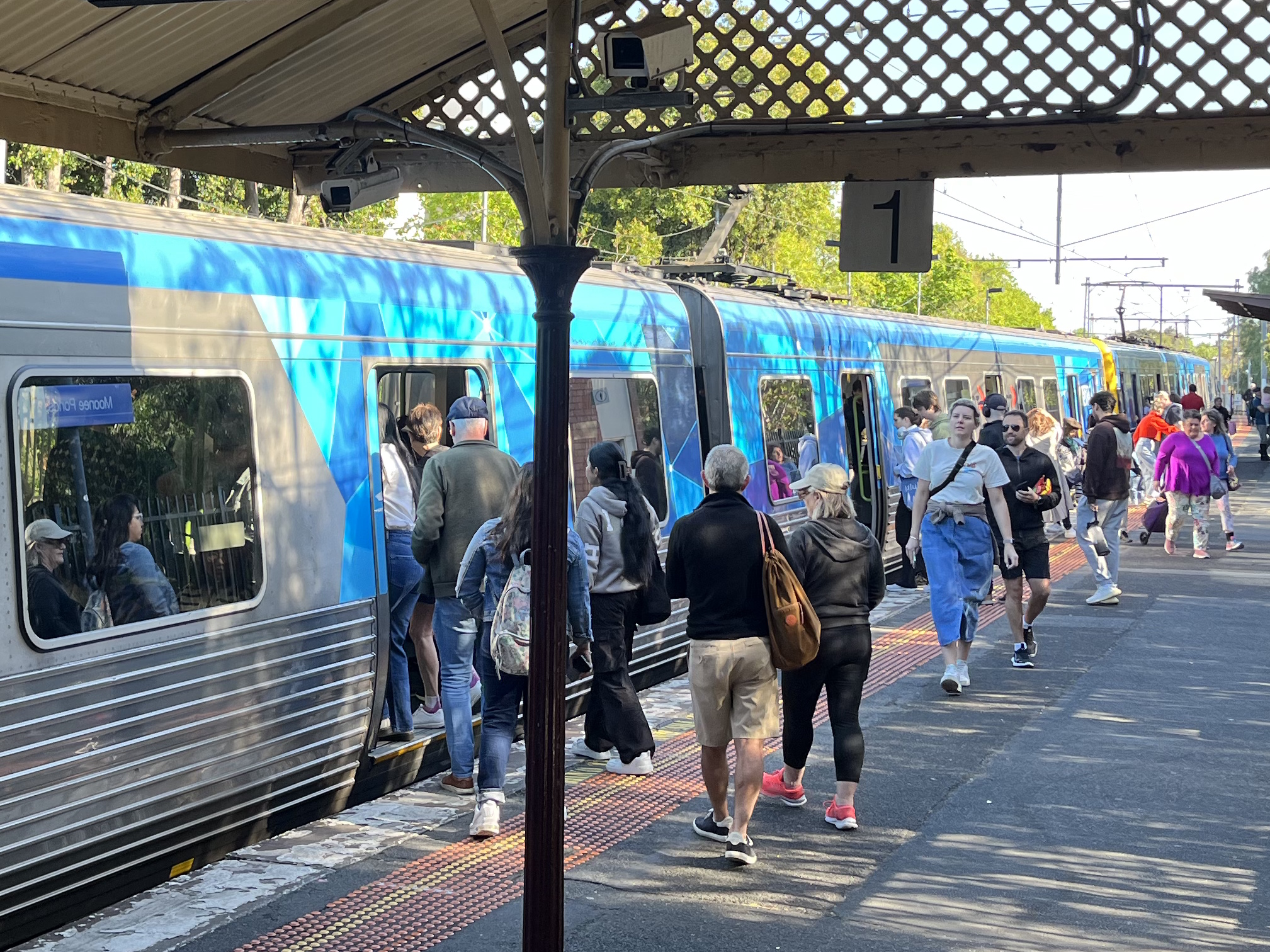 Crowd boarding a train at Moonee Ponds station